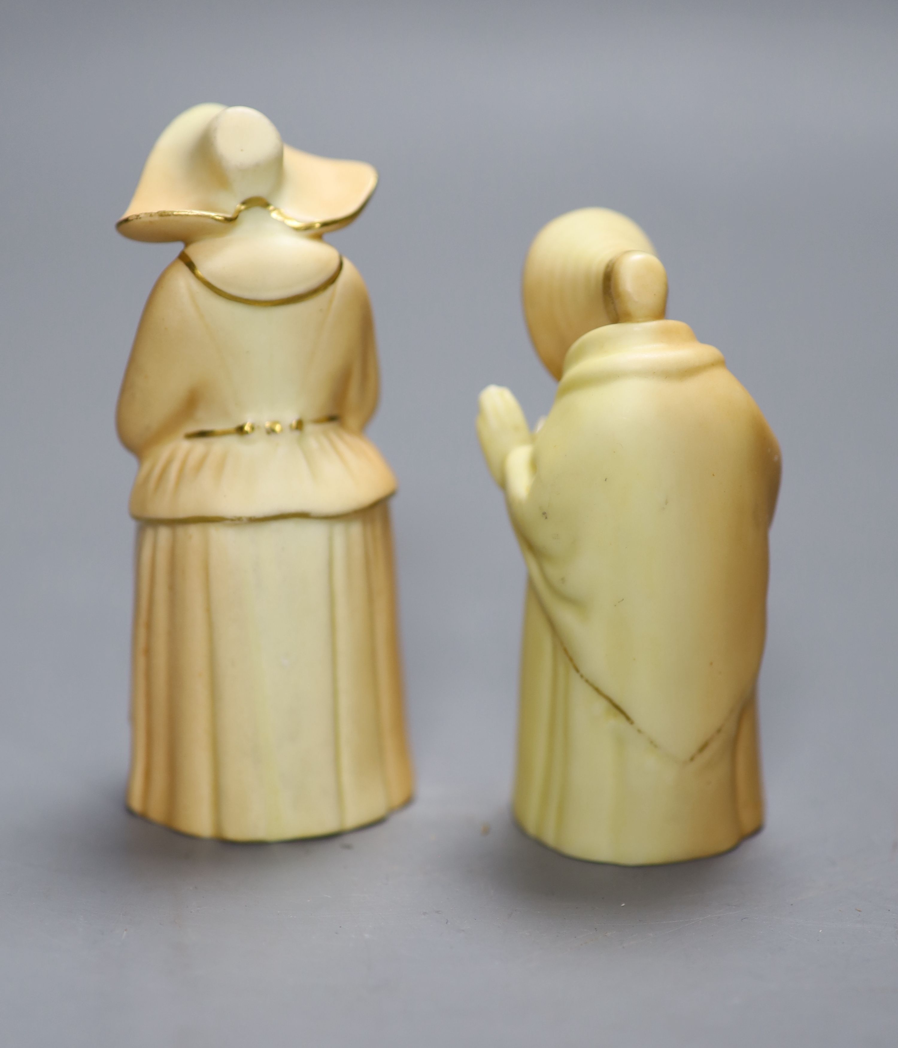 Two Royal Worcester blush ivory candle snuffers of Granny Snow and The Nun, date codes 1933 and 1920, height 10cm